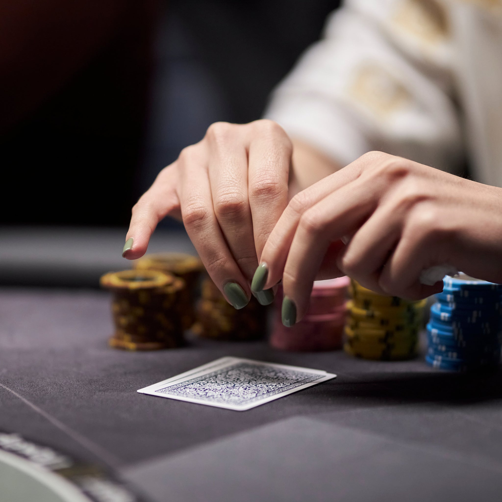 Clay poker chips and premium playing cards for home games