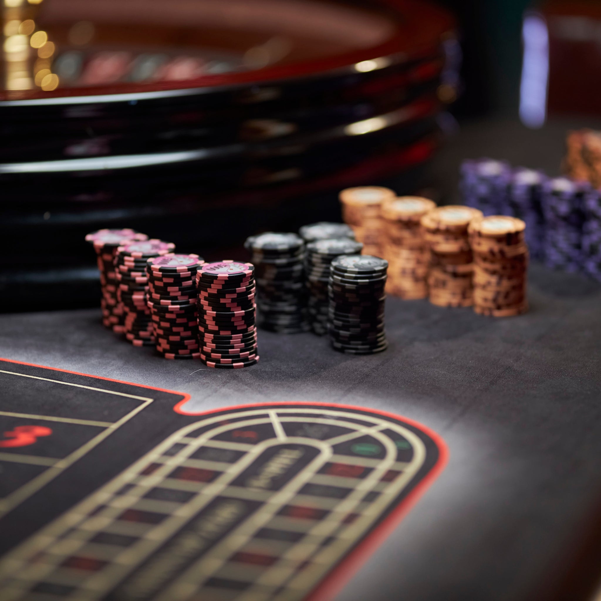 Top-down view of a professional poker table with poker chips, cards for home games