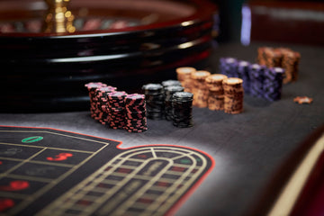 Top-down view of a professional poker table with poker chips, cards for home games