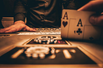 Clay composite poker chips being used during a poker game.